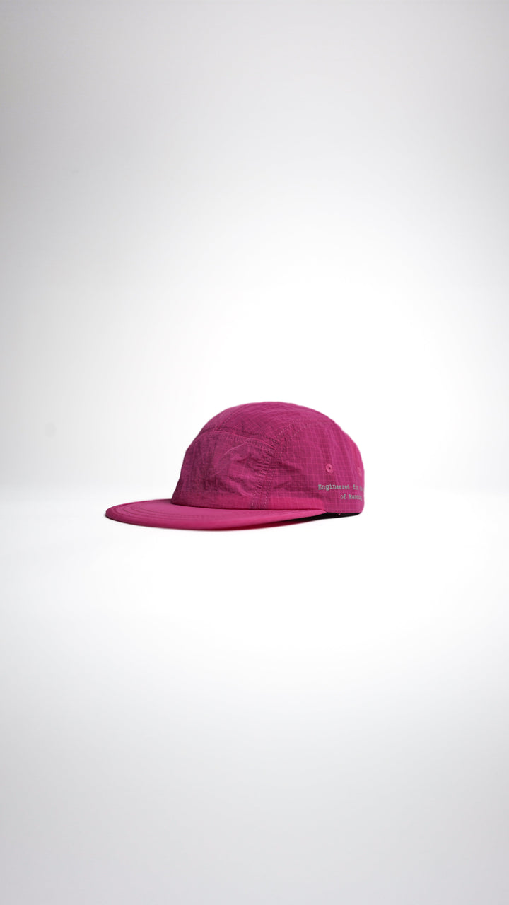 Lievre Running pink performance running cap, lightweight technical fabric with adjustable back cord and “Engineered for the Art of Running” text on the side panel.