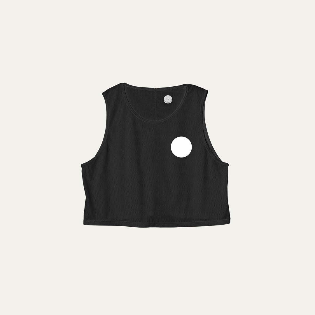 Participation black crop singlet, breathable mesh, white circle logo on chest.