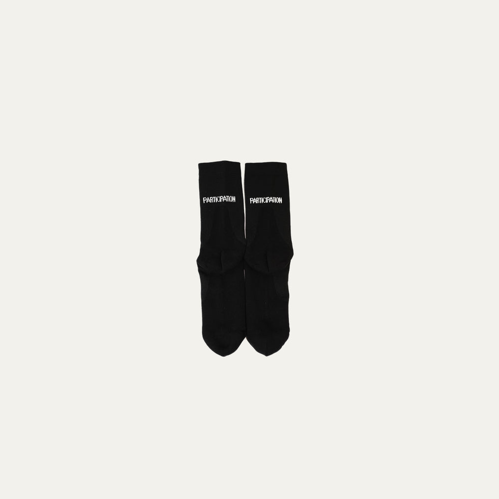 Participation black running socks, breathable knit crew, white PARTICIPATION logo and L/R foot markings.