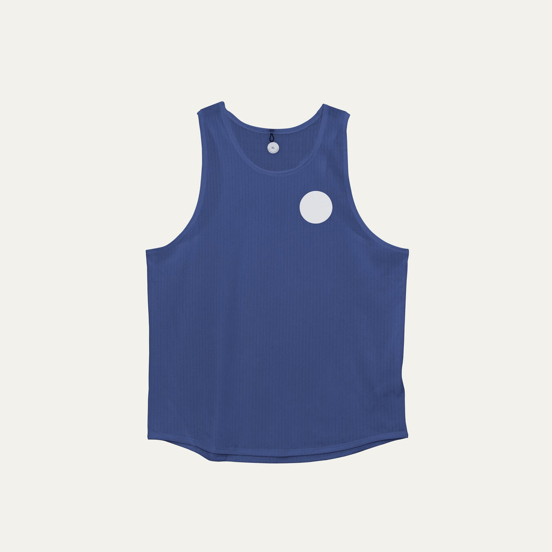 Blue running singlet from Participation, lightweight polyester construction designed for everyday training, photographed in a neutral studio setting.