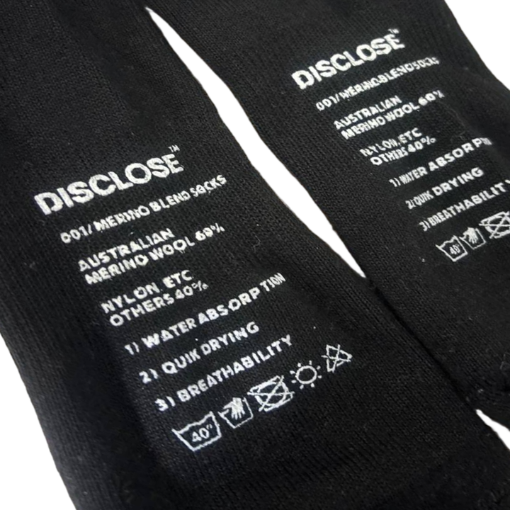 Black DISCLOSE 001 merino blend running socks made from soft, breathable merino wool blend fabric
