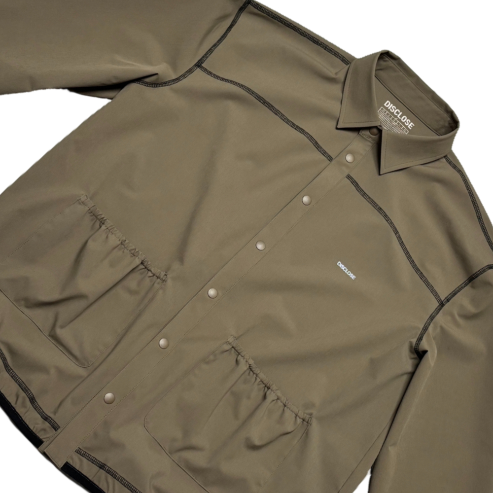 Khaki DISCLOSE 002 All Terrain Button Down Shirt, lightweight technical button down shirt designed for running, hiking, and changing outdoor conditions