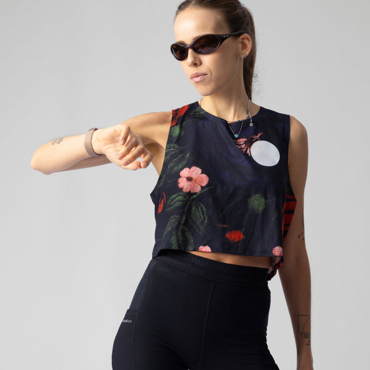 Front view of the Participation Embroidery Floral Crop Singlet, featuring a floral design and breathable fabric.