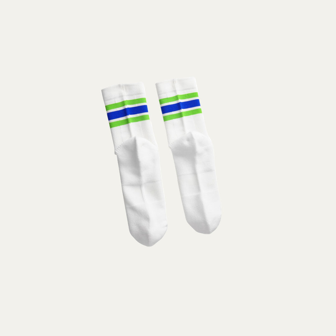 Participation Blue in Green running socks, breathable white mesh with blue-green cuff stripes, green foot branding.