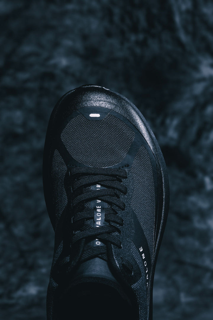 Detail of the black Valone Rave Arnev, technical trail running shoe made in Europe