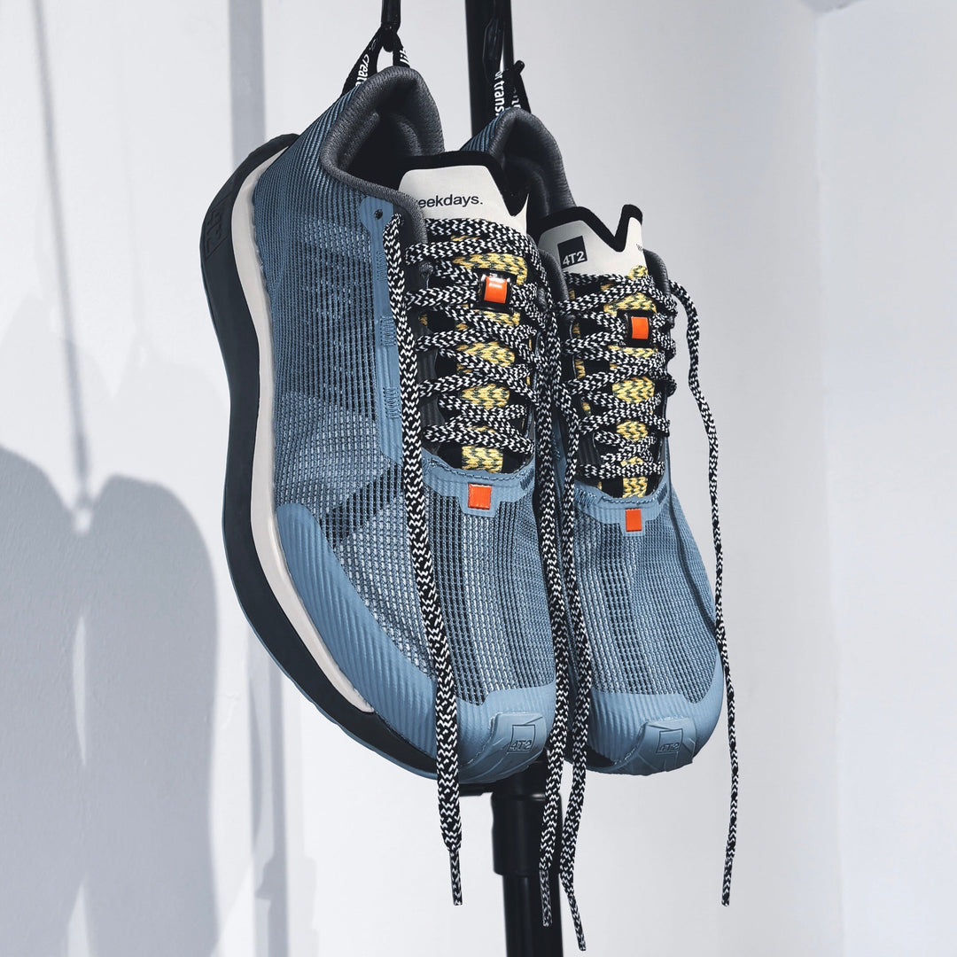 4T2 - weekdays, kind of blue running shoe, showcasing a modern design ideal for urban running.
