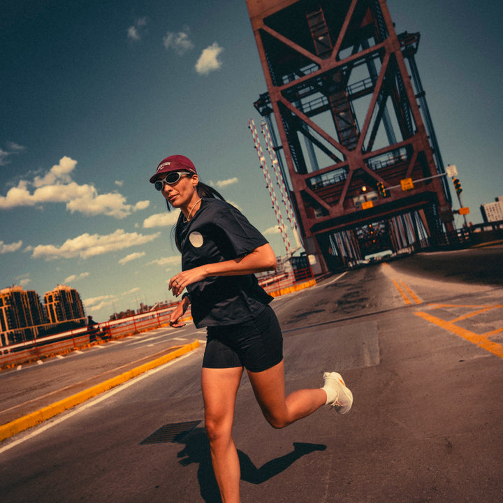 Participation Aberdeen running cap, maroon 5-panel with curved brim and white “ABERDEEN TRACK” embroidery.