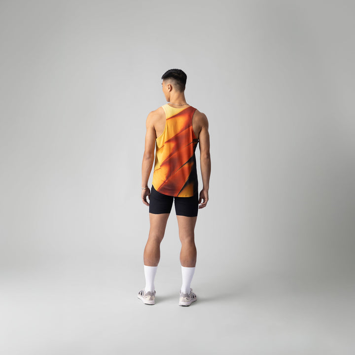 A lightweight and breathable orange singlet from Participation, designed for activewear with moisture-wicking properties.