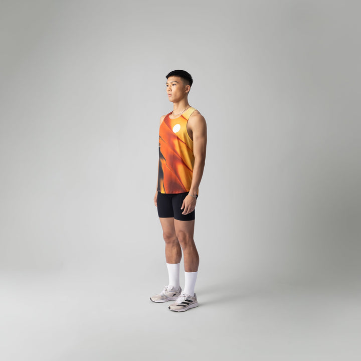 A lightweight and breathable orange singlet from Participation, designed for activewear with moisture-wicking properties.