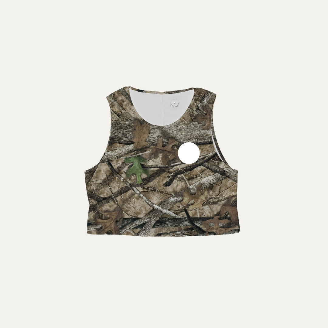 Participation Real Tree crop singlet, breathable mesh, camo forest print, white circle logo on chest.