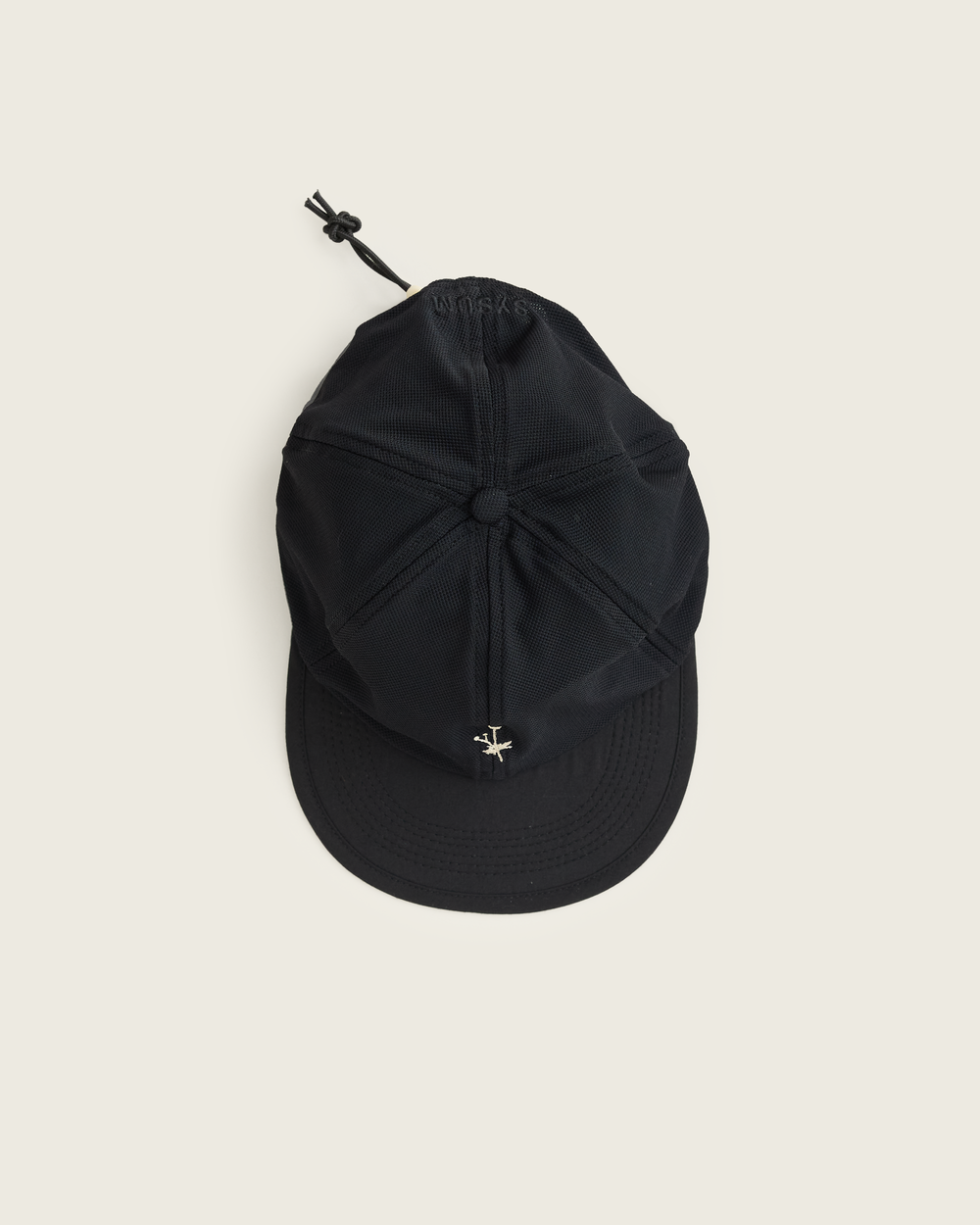 6-panel mesh running cap in Buttercup and Black from Sysum, lightweight construction with soft foam bill and adjustable back strap visible, photographed in a neutral studio setting.