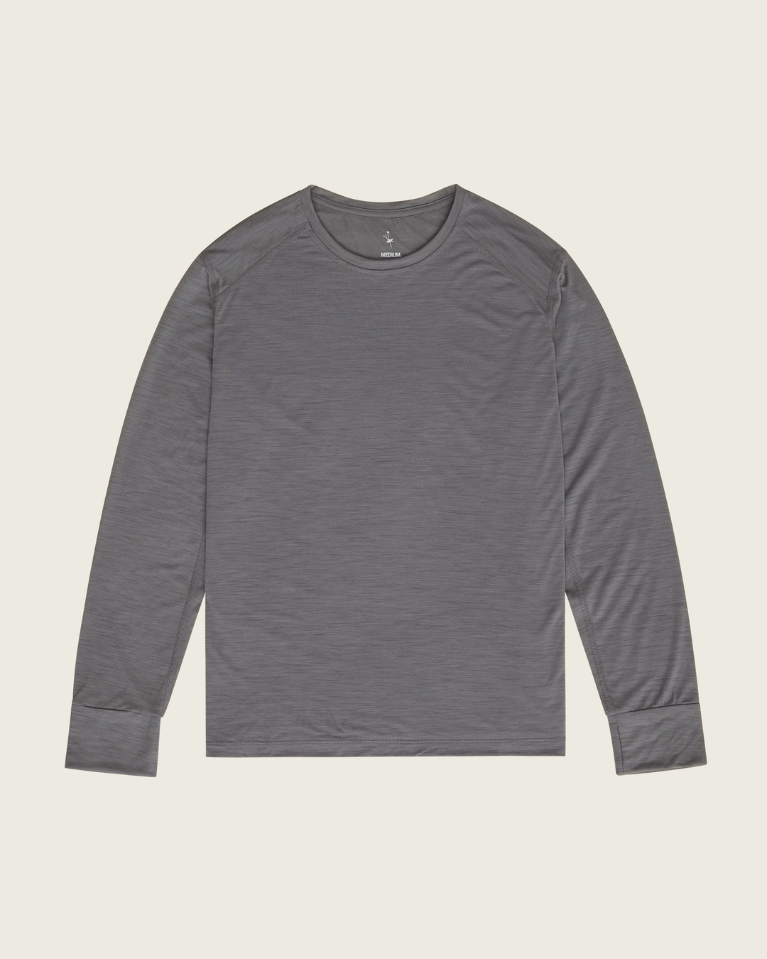 Men’s merino long-sleeve running top in Slate from Sysum, lightweight knit visible, photographed in a neutral studio setting.