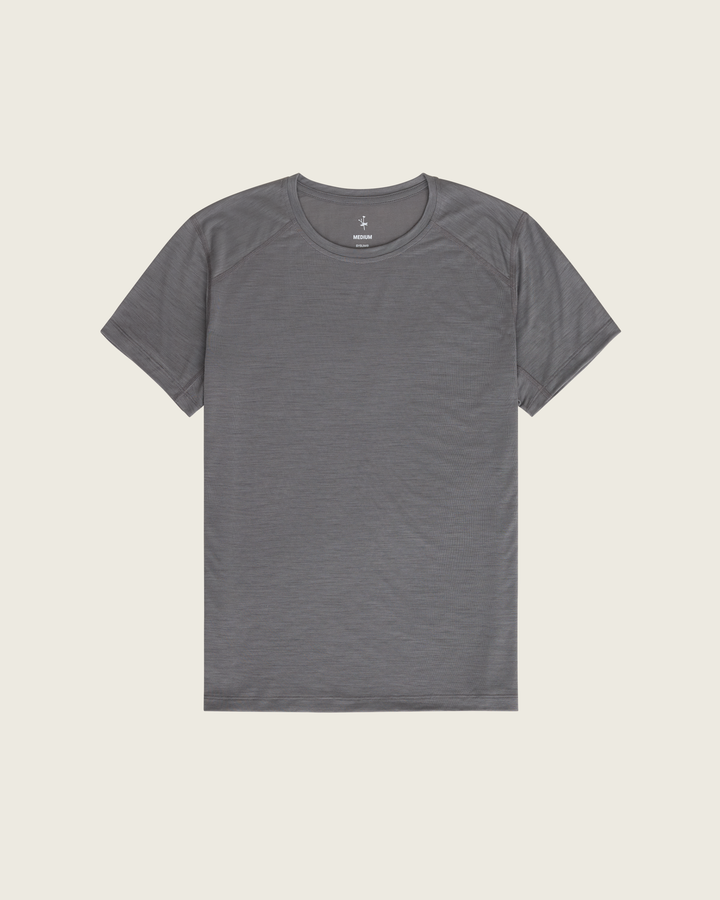 Men’s merino short-sleeve running tee in Slate from Sysum, lightweight knit texture visible, photographed in a neutral studio setting.