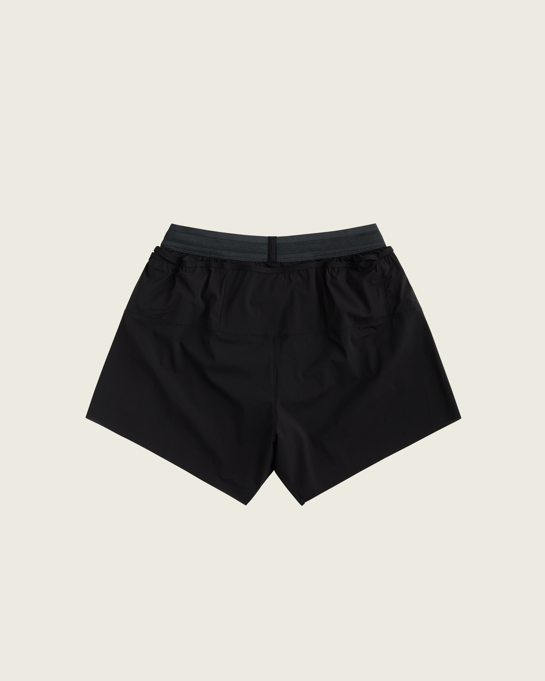 Men’s 4-inch Cordura® trail running shorts in Black from Sysum, ultra-light stretch fabric and pocket system visible, photographed in a neutral studio setting.