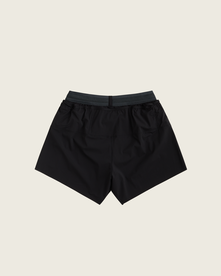 Men’s 4-inch Cordura® trail running shorts in Black from Sysum, ultra-light stretch fabric and pocket system visible, photographed in a neutral studio setting.