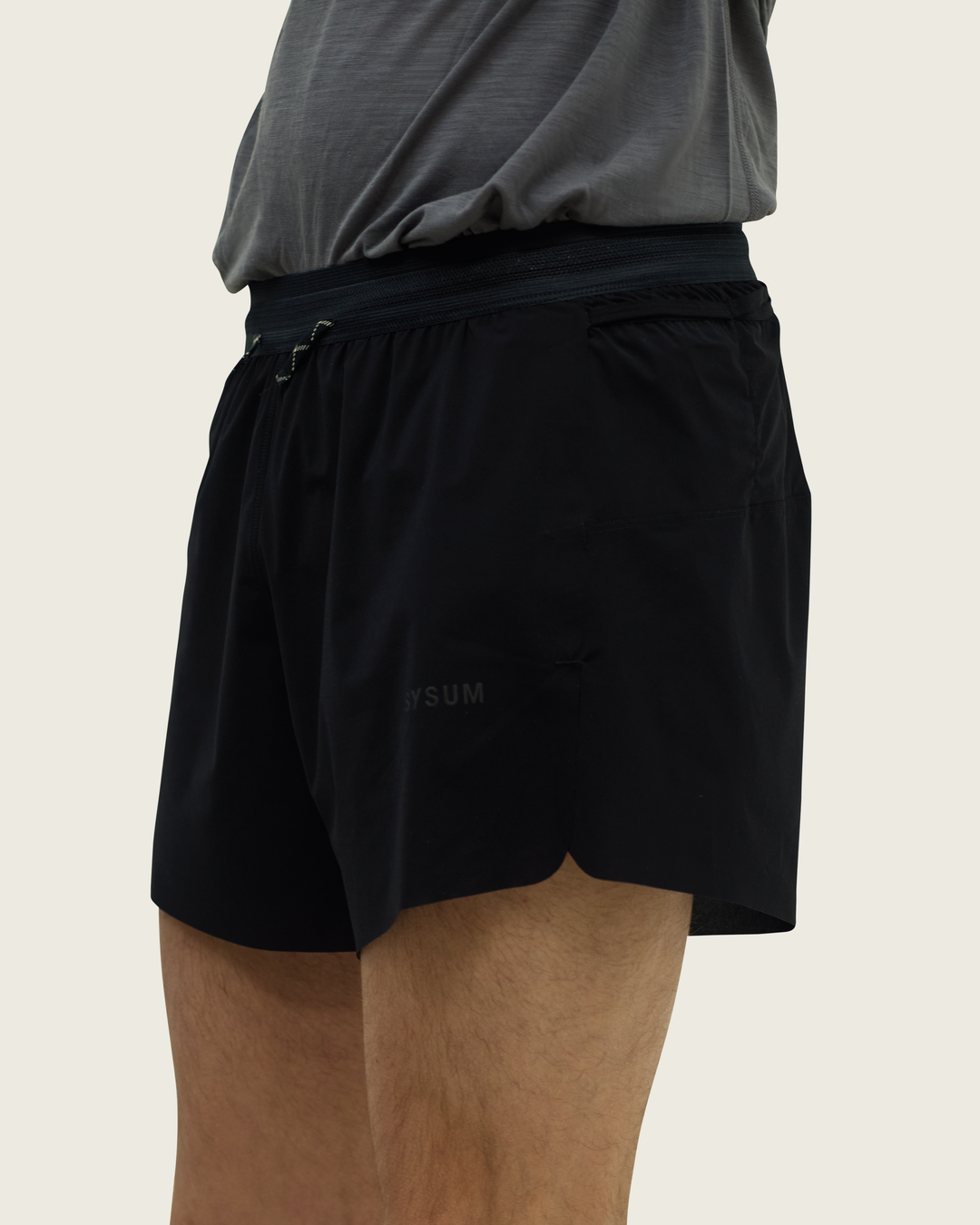 Men’s 4-inch Cordura® trail running shorts in Black from Sysum, ultra-light stretch fabric and pocket system visible, photographed in a neutral studio setting.