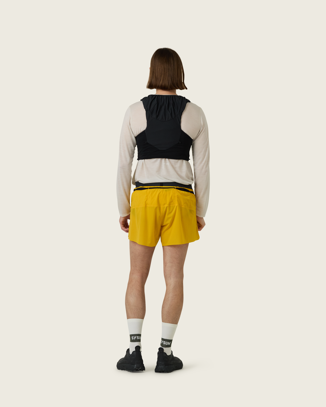 Men’s 4-inch Cordura® trail running shorts in Sap from Sysum, ultra-light stretch fabric and pocket system visible, photographed in a neutral studio setting.