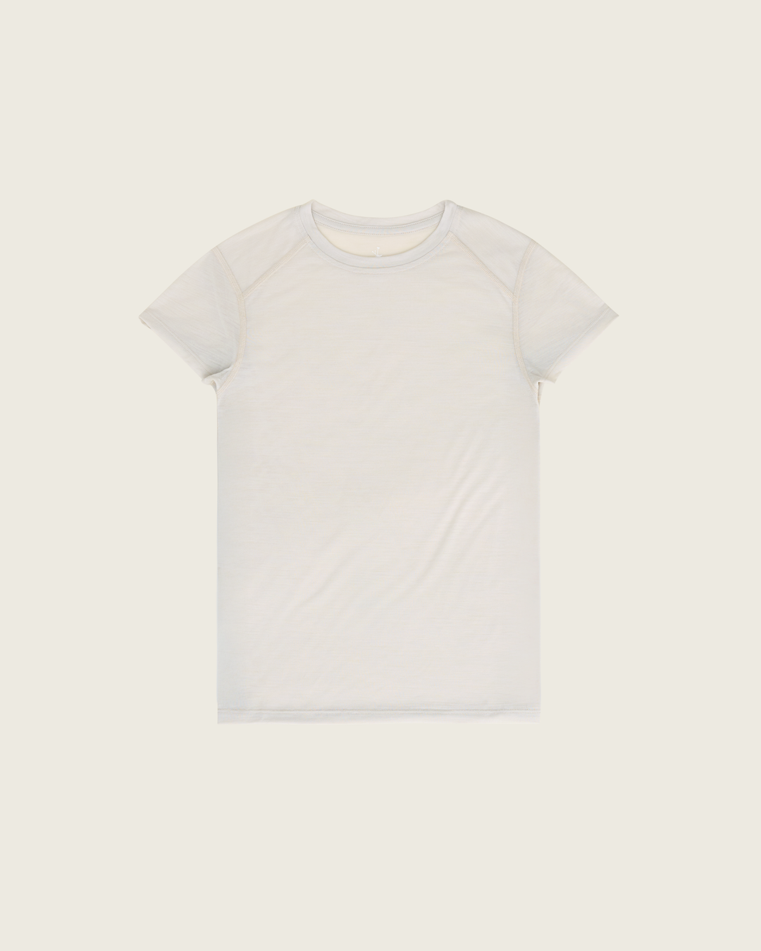 Women’s ultra-light merino short-sleeve running tee in Pebble from Sysum, fine knit texture visible, photographed in a neutral studio setting.