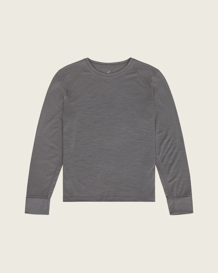 Women’s merino long-sleeve running top in Slate from Sysum, lightweight knit texture visible, photographed in a neutral studio setting.