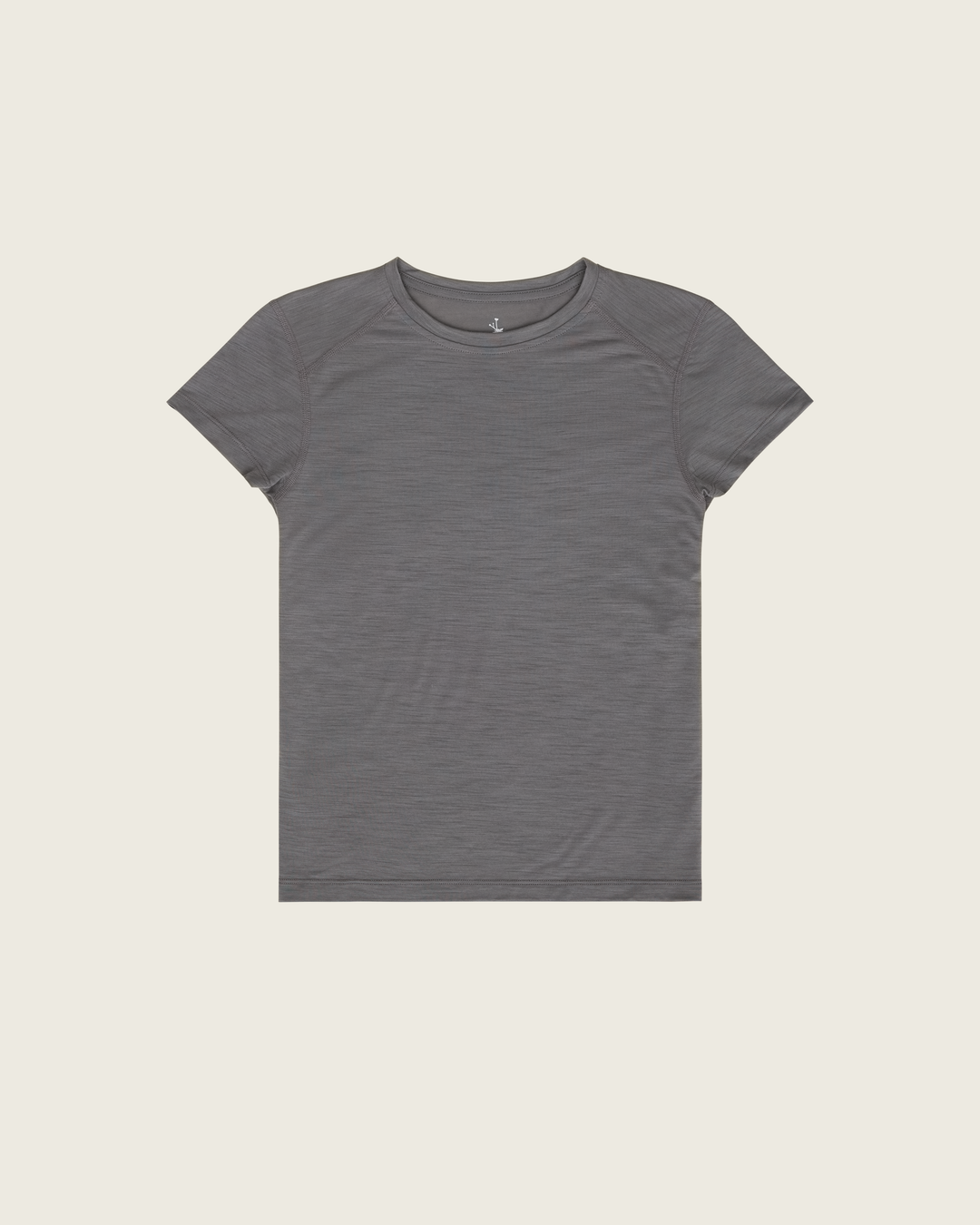 Women’s merino short-sleeve running tee in Slate from Sysum, lightweight knit texture visible, photographed in a neutral studio setting.