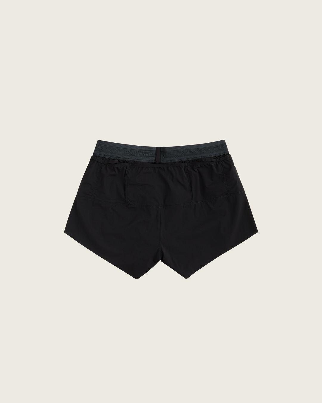 Women’s 3-inch Cordura® trail running shorts in Black from Sysum, ultra-light stretch fabric and pocket system visible, photographed in a neutral studio setting.