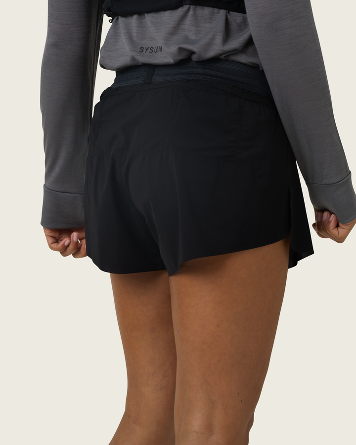 Women’s 3-inch Cordura® trail running shorts in Black from Sysum, ultra-light stretch fabric and pocket system visible, photographed in a neutral studio setting.