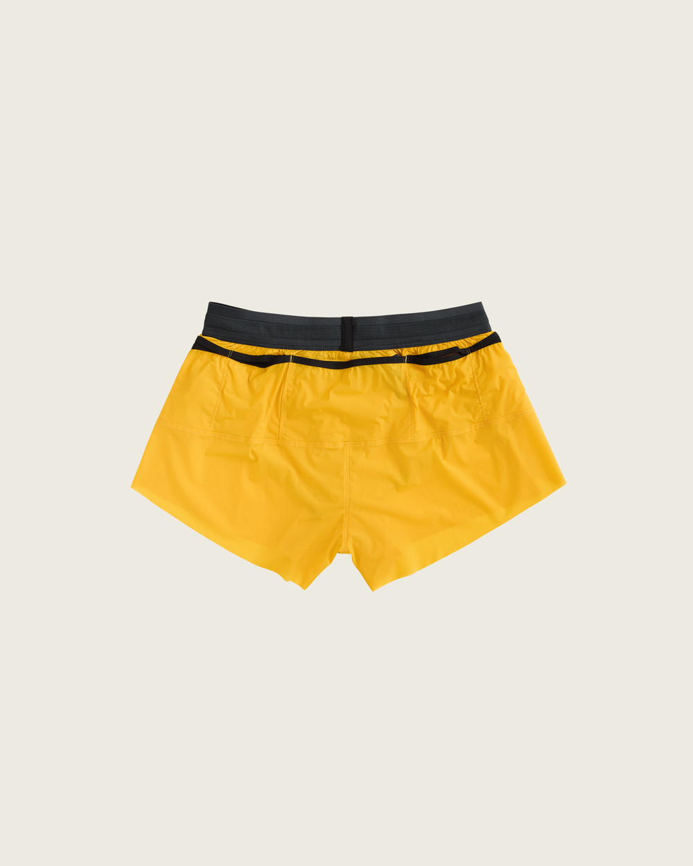 Women’s 3-inch Cordura® trail running shorts in Sap from Sysum, ultra-light stretch fabric and pocket system visible, photographed in a neutral studio setting.