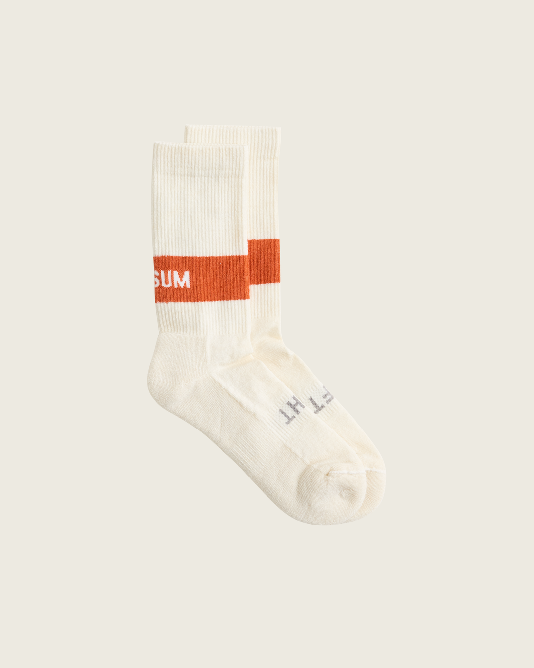 Woollen crew running socks in Clay from Sysum, mid-length design with cushioned zones and textured knit visible, photographed in a neutral studio setting.