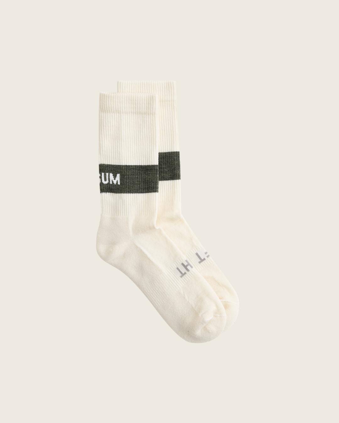 Woollen crew running socks in Moss from Sysum, mid-length design with cushioned zones and textured knit visible, photographed in a neutral studio setting.