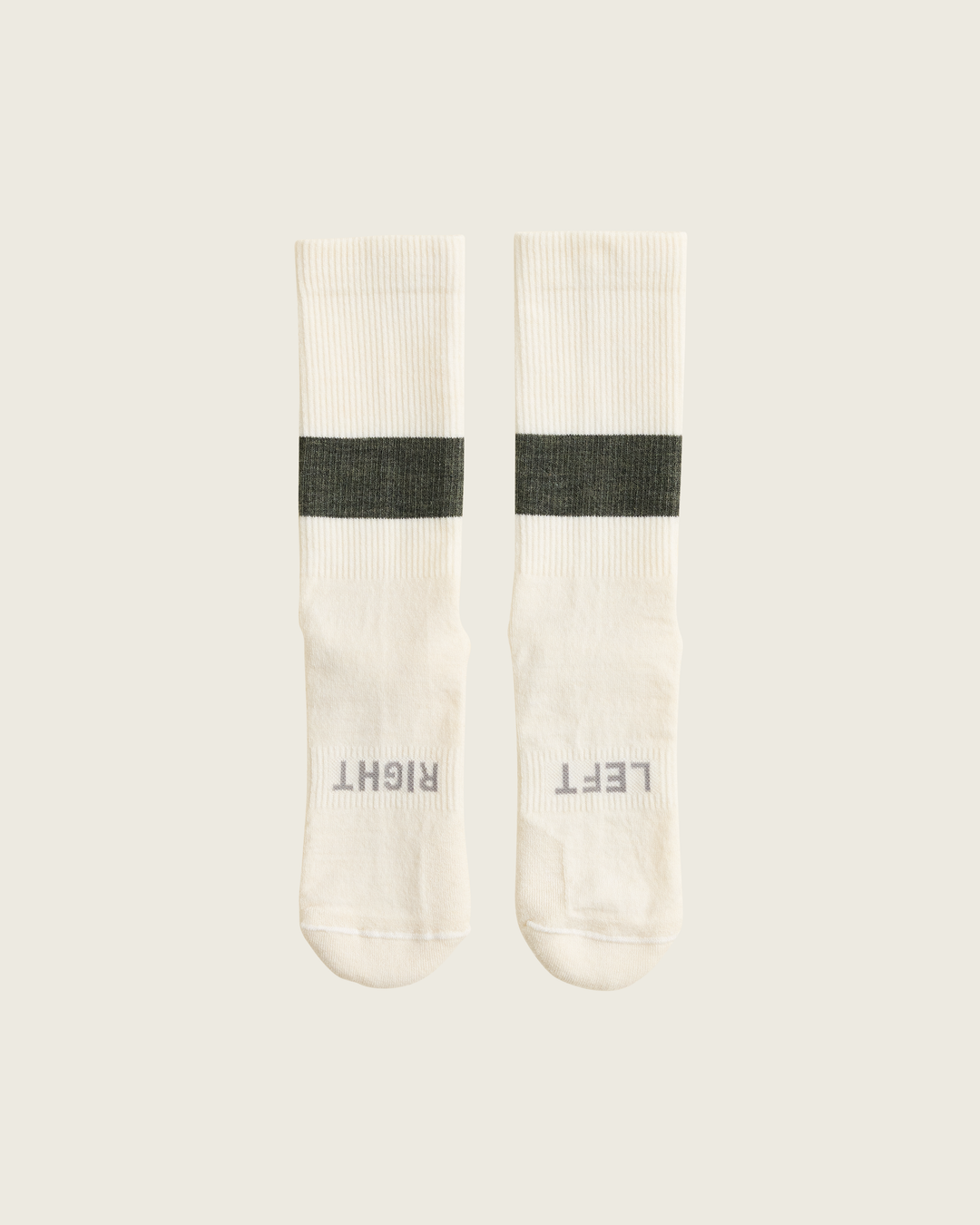 Woollen crew running socks in Moss from Sysum, mid-length design with cushioned zones and textured knit visible, photographed in a neutral studio setting.