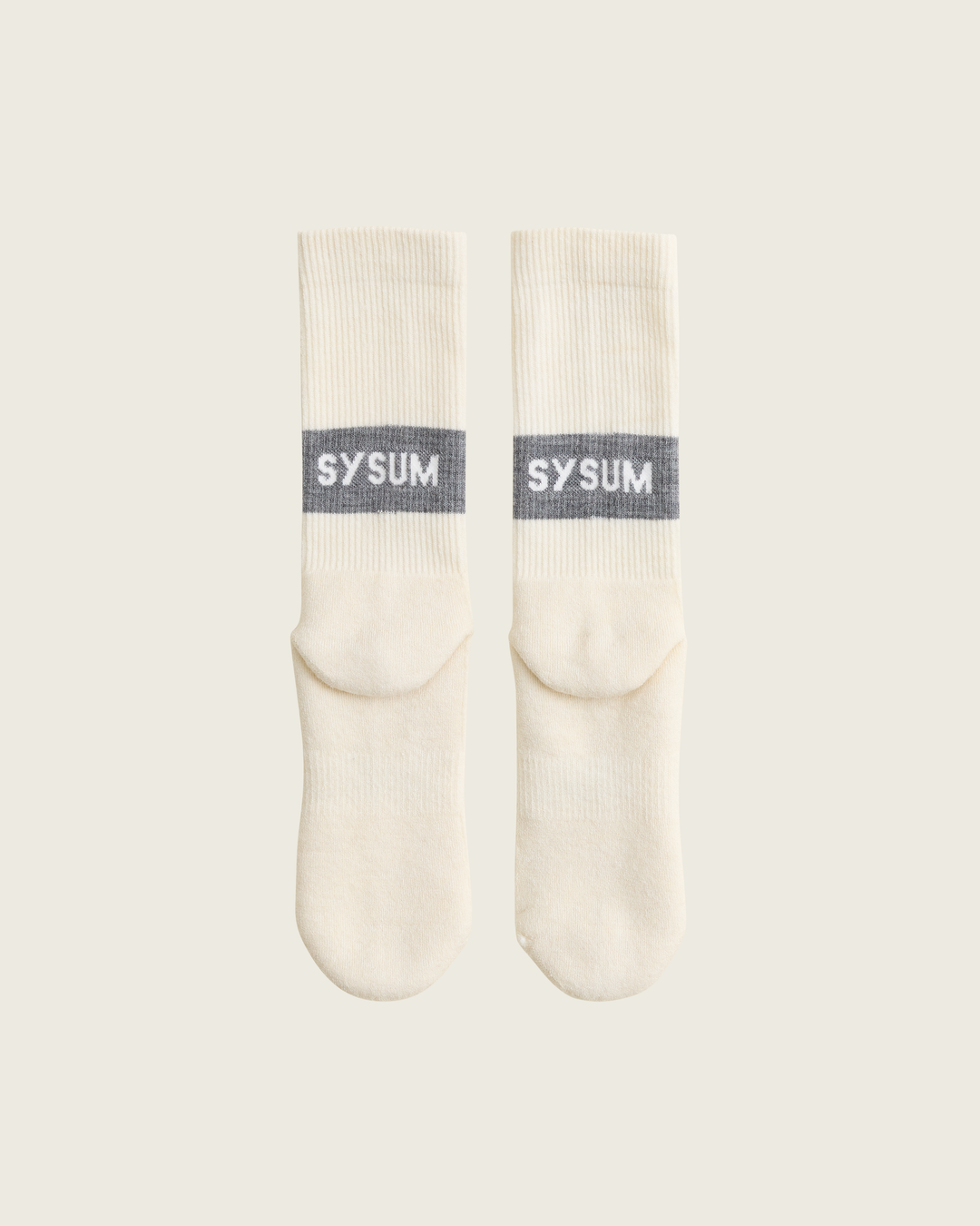 Woollen crew running socks in Slate from Sysum, mid-length design with cushioned zones and textured knit visible, photographed in a neutral studio setting.