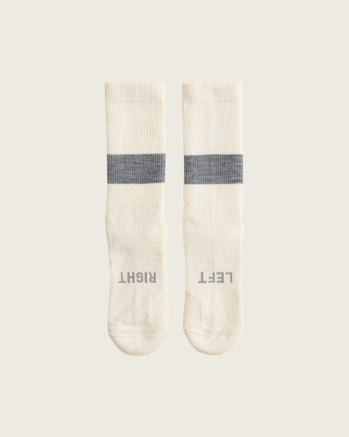 Woollen crew running socks in Slate from Sysum, mid-length design with cushioned zones and textured knit visible, photographed in a neutral studio setting.
