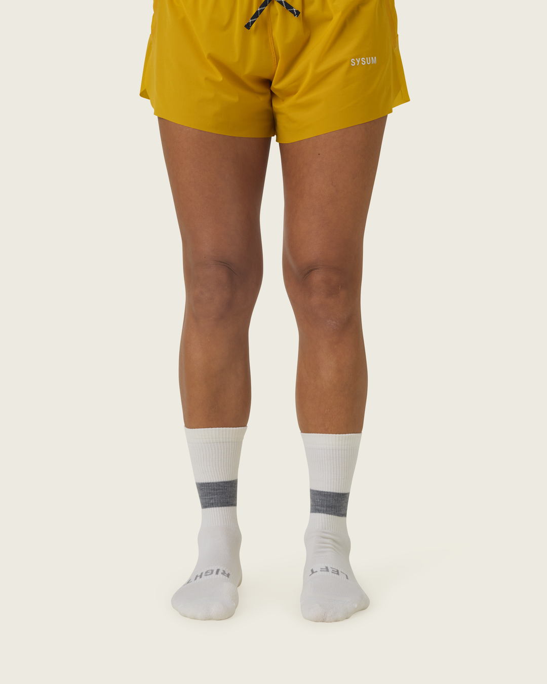 Woollen crew running socks in Slate from Sysum, mid-length design with cushioned zones and textured knit visible, photographed in a neutral studio setting.