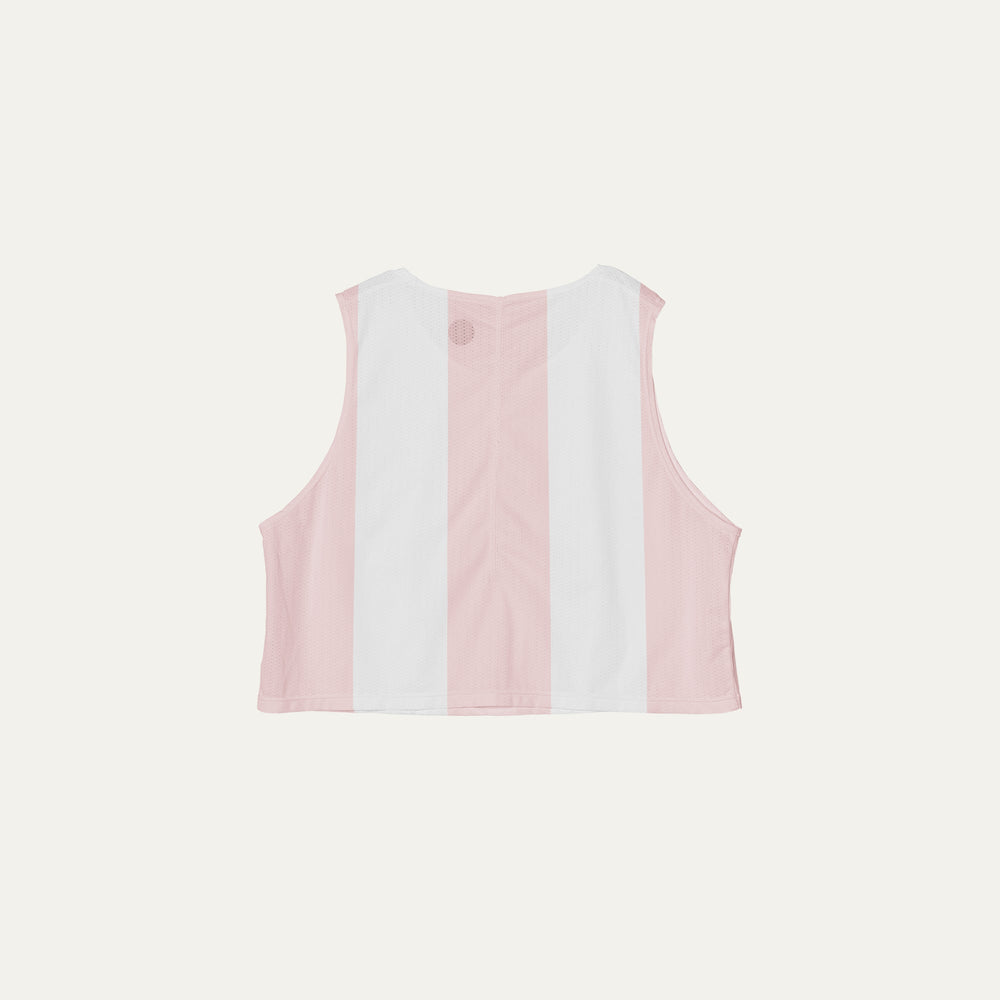 Cropped running singlet from Participation with pink stripe detailing, lightweight polyester construction for warm-weather training and racing, photographed in a neutral studio setting.