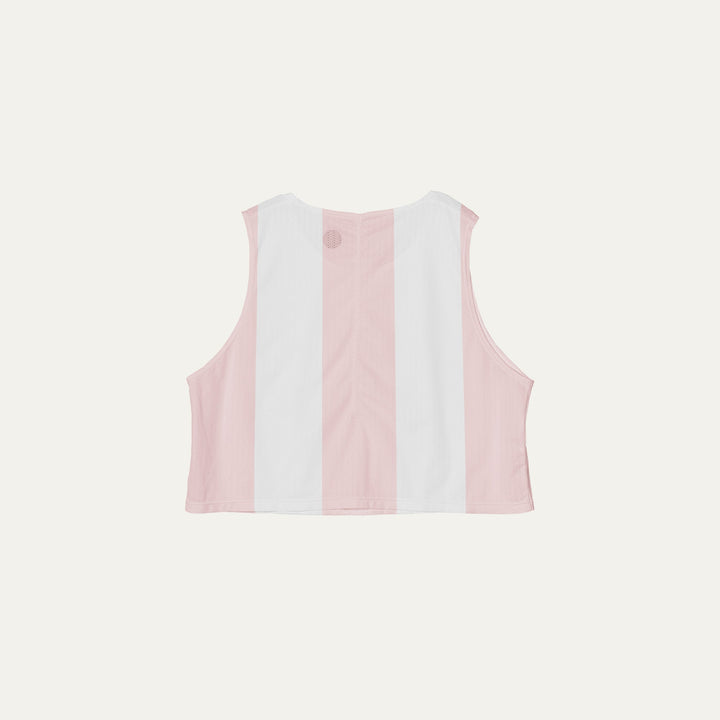 Cropped running singlet from Participation with pink stripe detailing, lightweight polyester construction for warm-weather training and racing, photographed in a neutral studio setting.