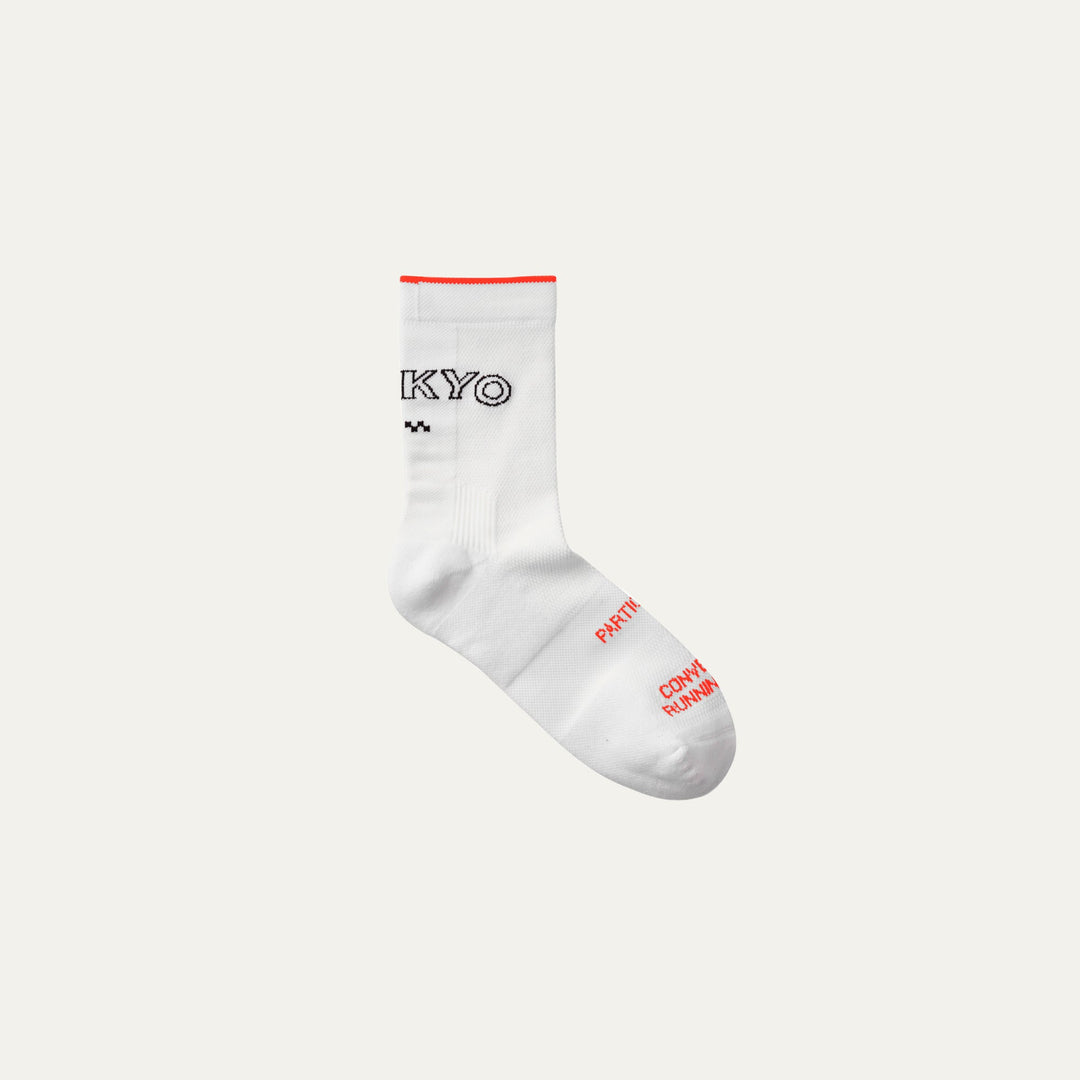 Participation Tokyo running socks, breathable white mesh, red trim, “TOKYO” text with red foot branding.