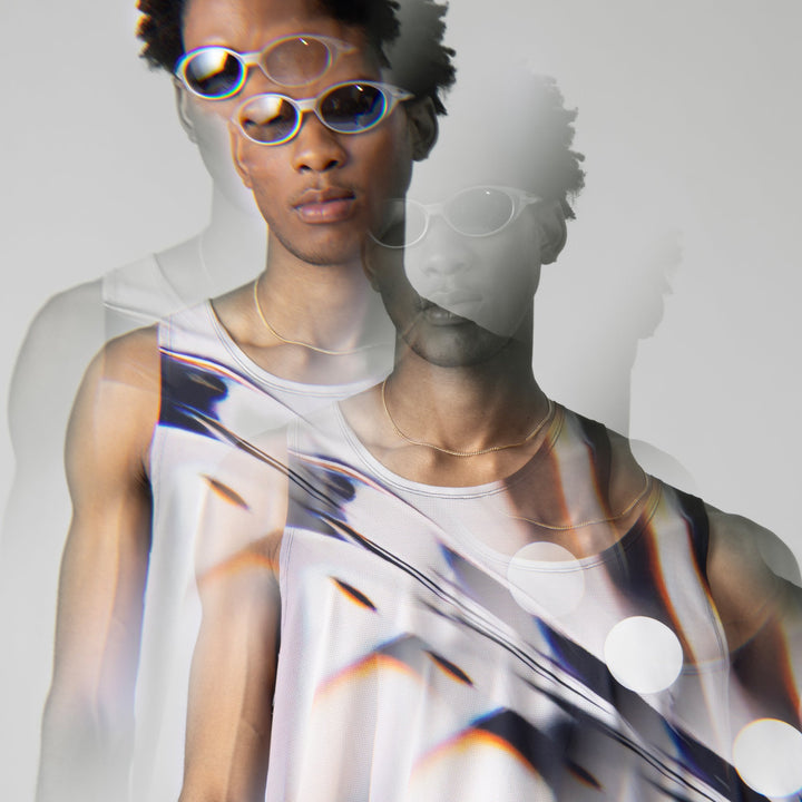 A stylish white glass effect singlet for activewear, showcasing breathable fabric and a sleeveless design.
