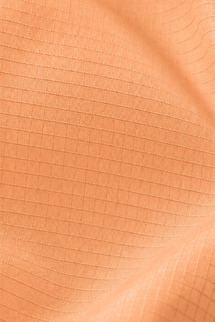 Lievre Running light salmon performance running cap, lightweight technical fabric with adjustable back cord and "Engineered for the Art of Running" text on the side panel.