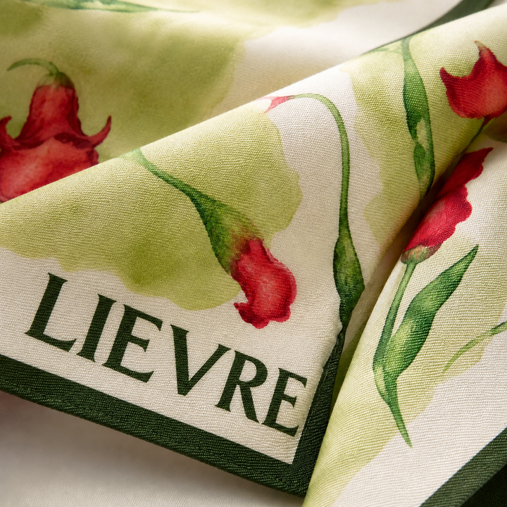 Lievre Running Le Langage des Fleurs gavroche bandana featuring a vibrant floral illustrated pattern, lightweight fabric designed for running and outdoor use.