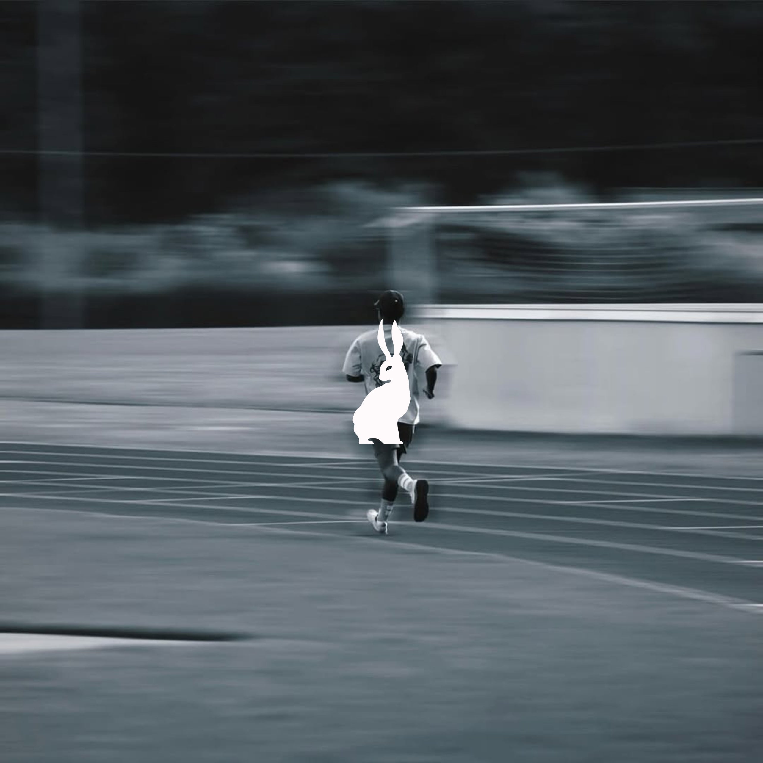 Man running on track with Lievre Running gear
