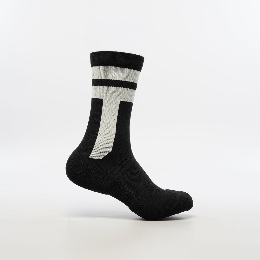 Black crew-length T2 Ultra Socks by Tabisuke Tabizo, featuring foot-mapped knit structure, arch compression, and Dralon Cotton fabric for trail running and fastpacking.