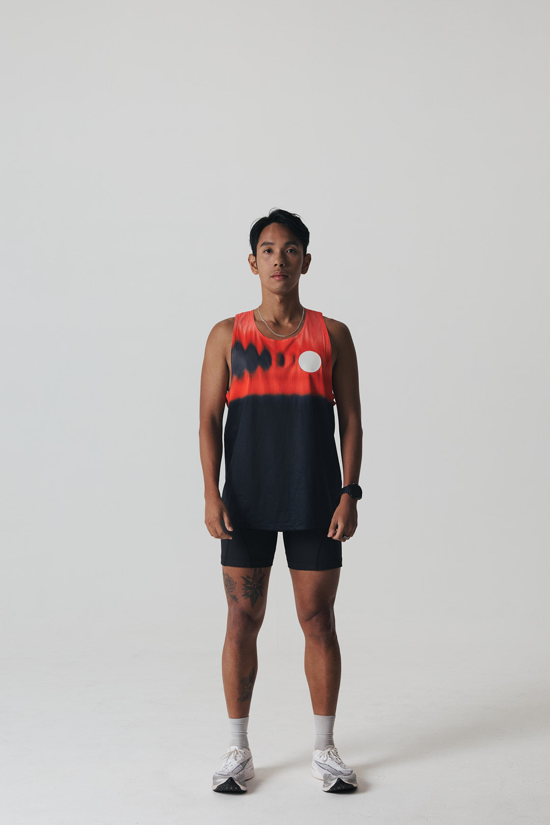 Participation Red Glass running singlet, breathable mesh, red-black gradient, white circle logo on chest.