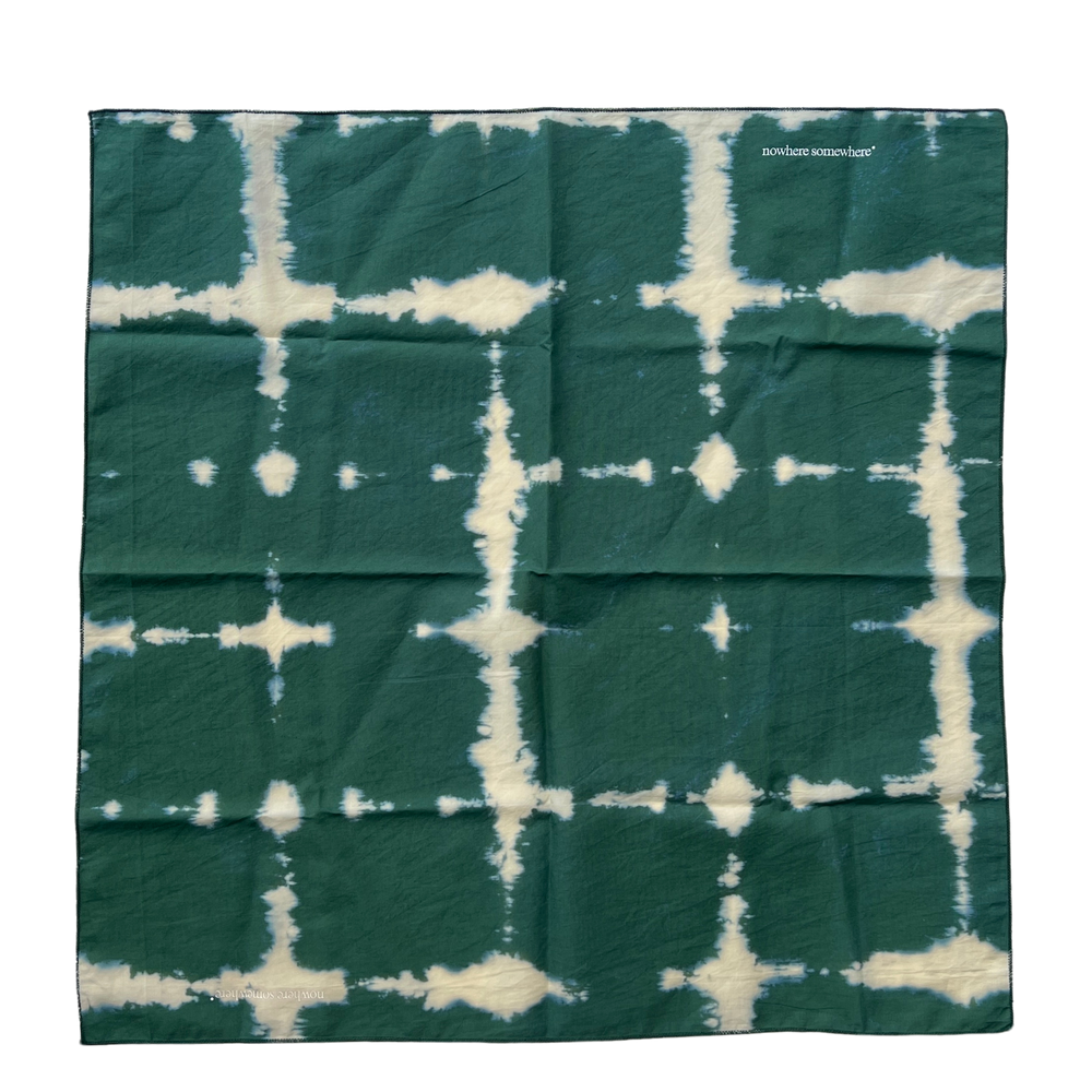 Nowhere Somewhere Peace Bandana in indigo, flat lay