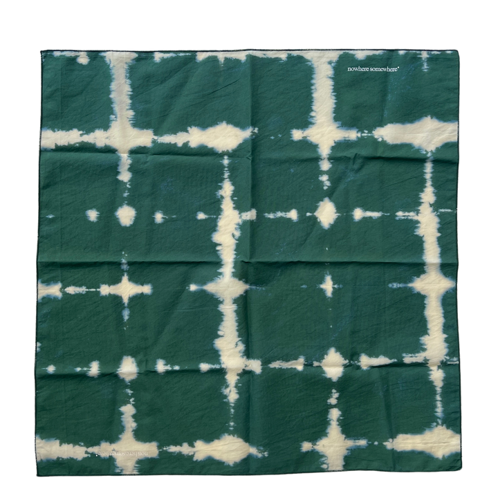 Nowhere Somewhere Peace Bandana in indigo, flat lay