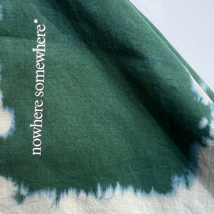 Nowhere Somewhere Peace Bandana in indigo, flat lay