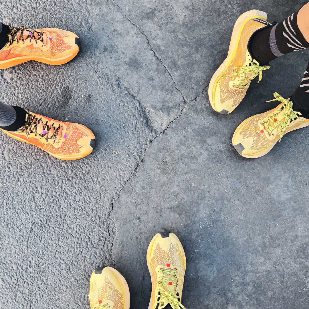4T2 one more running shoe in orange, featuring a breathable upper and a durable rubber outsole designed for speed and traction.