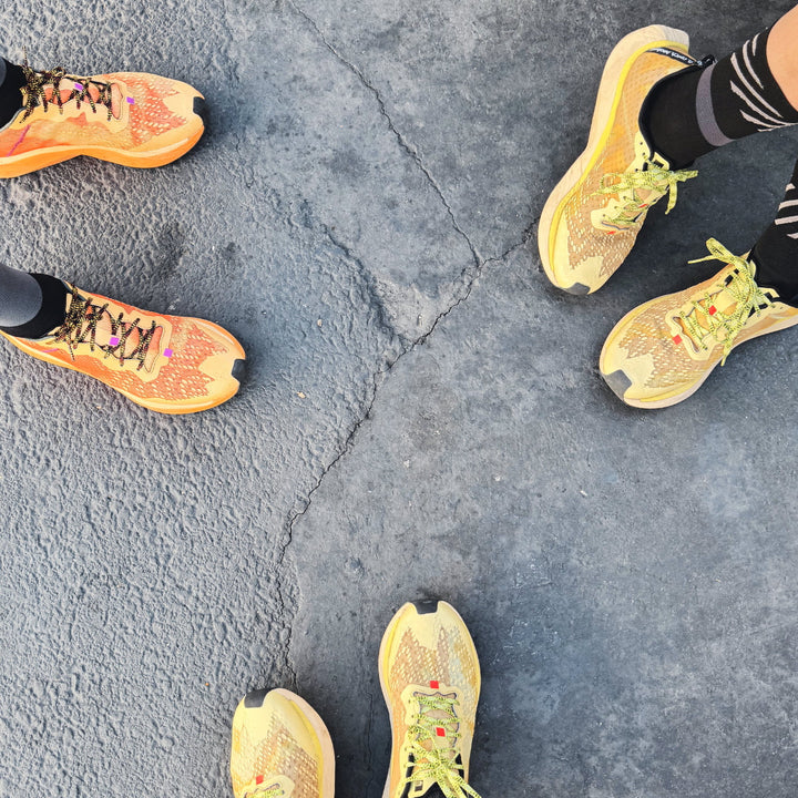 4T2 one more running shoe in orange, featuring a breathable upper and a durable rubber outsole designed for speed and traction.