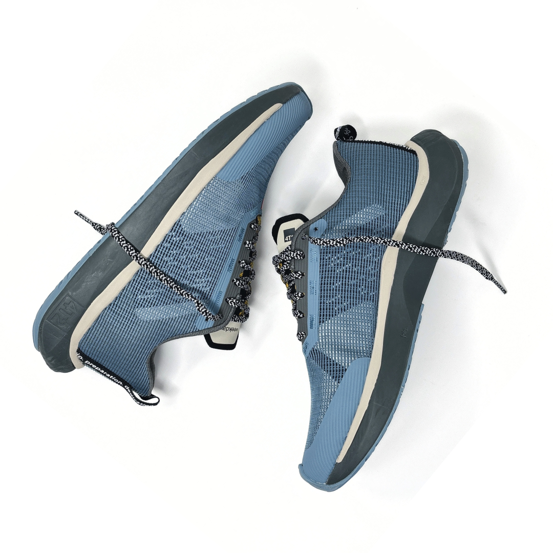 4T2 - weekdays, kind of blue running shoe, showcasing a modern design ideal for urban running.