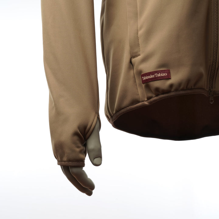 Tabisuke Tabizo T2 Jogger Jacket 2025 in brown, winter running jacket with Artica stretch fabric, thumbholes and watch opening