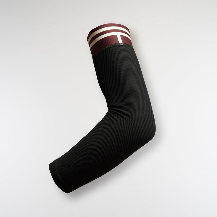 Black racing arm sleeve with lightweight compression and asymmetrical design for running and racing.